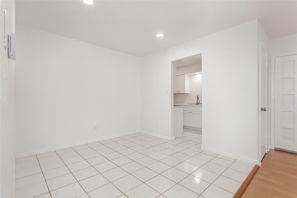 6061 Milton Street, Unit 231 Dallas, TX 75206 - Photo 5 of 27 Bright dining space with recessed lighting and an open connection to the main living area.