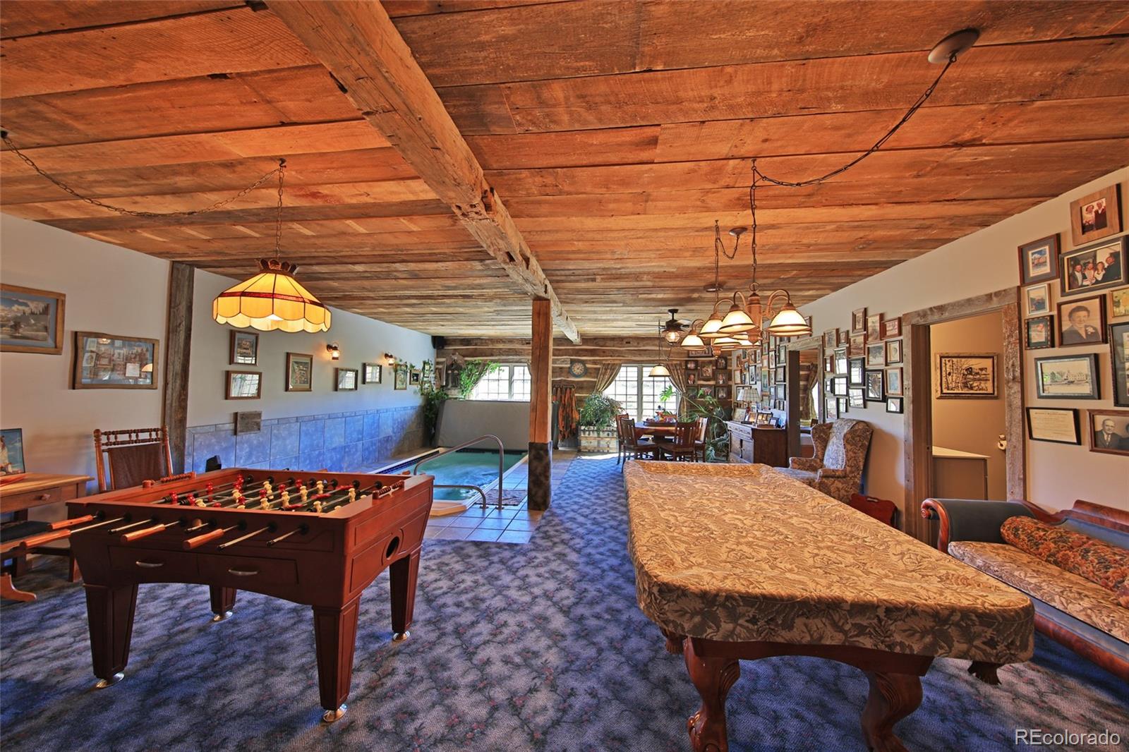 10497-54 54 7/10 Road Molina, CO 81646 - Photo 16 of 45 a dining room with a wooden table and chairs