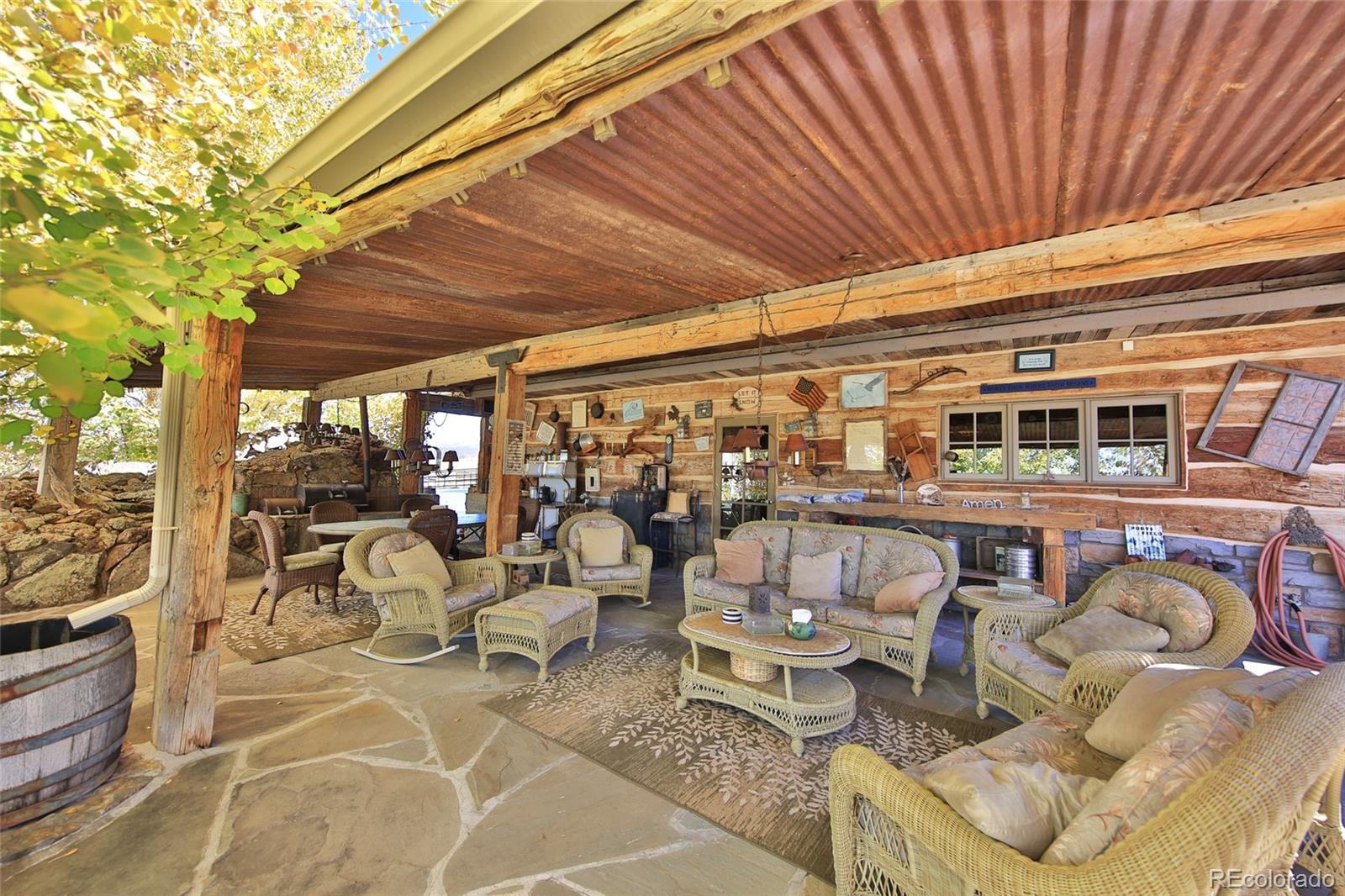 10497-54 54 7/10 Road Molina, CO 81646 - Photo 24 of 45 a roof deck view with table and chairs and potted plants