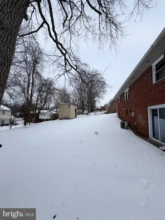 a view of snow covered with snow in yard