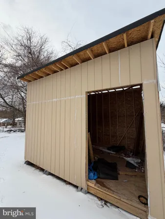 a view of a back yard of the house and wooden fence
