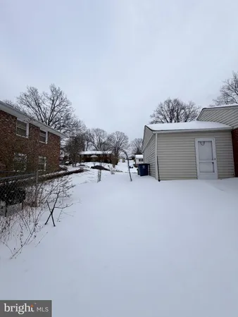 a view of a terrace with a bench and trees