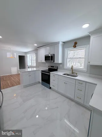 a large kitchen with cabinets