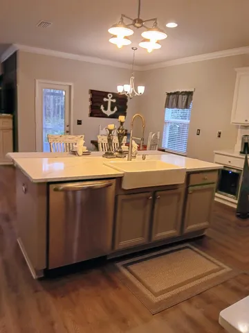 a kitchen with a stove a refrigerator and a fireplace
