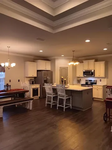 a view of a room with wooden floor