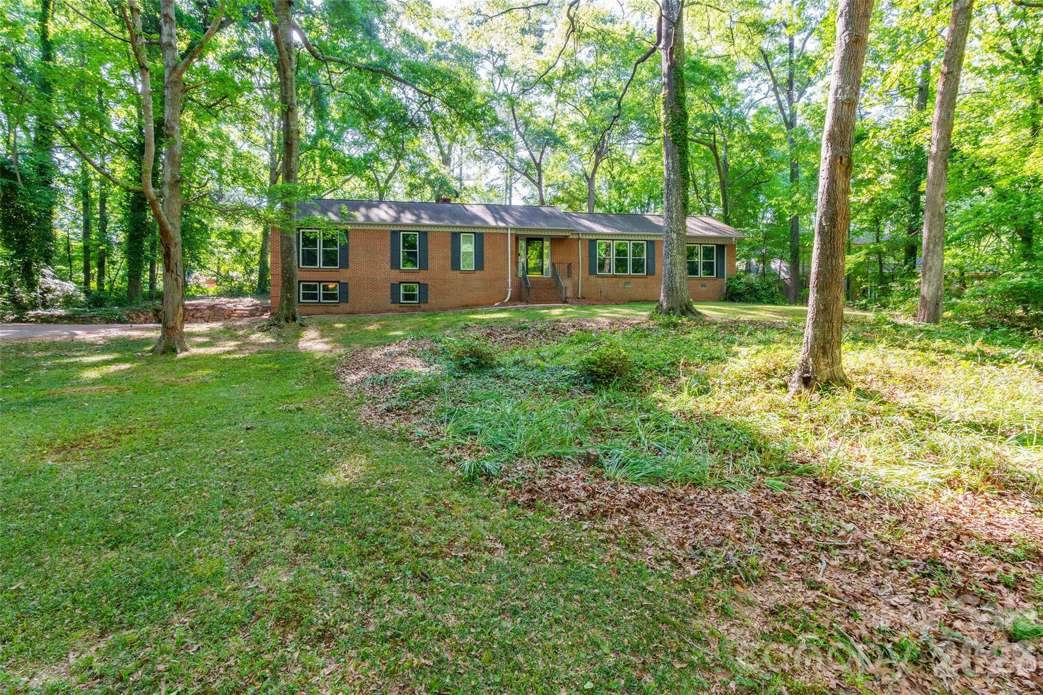 513 Mountainbrook Road Lancaster, SC 29720 - Photo 2 of 48 a front view of a house with a garden