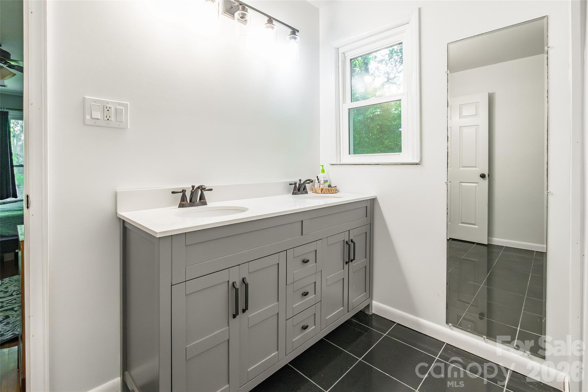 513 Mountainbrook Road Lancaster, SC 29720 - Photo 29 of 48 a bathroom with a double vanity sink a and mirror