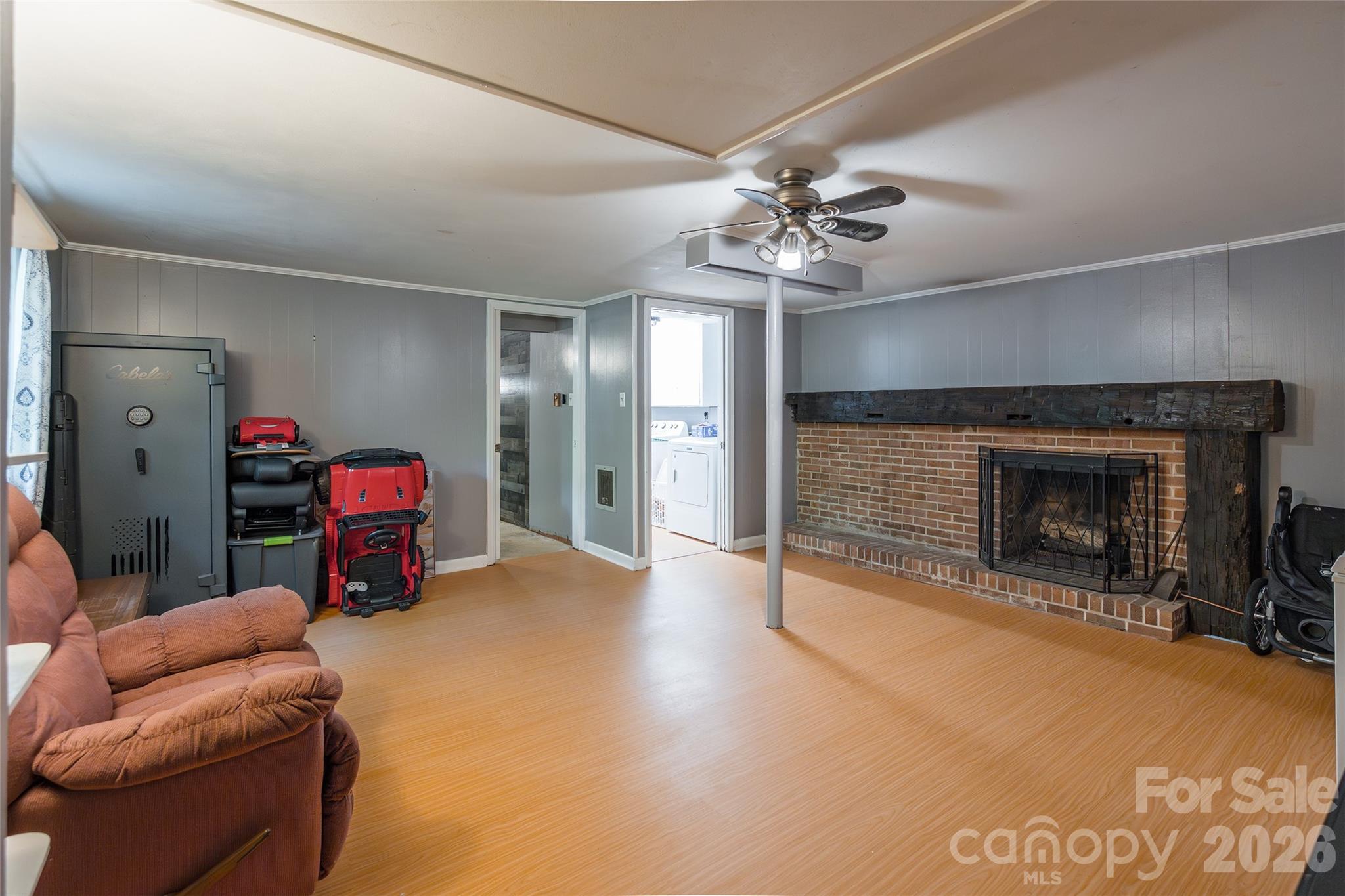 513 Mountainbrook Road Lancaster, SC 29720 - Photo 39 of 48 a living room with furniture a fireplace and a chandelier