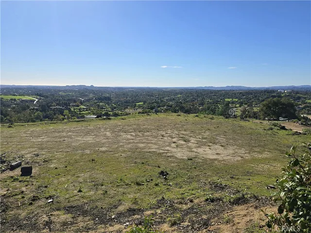an aerial view of residential house and green space
