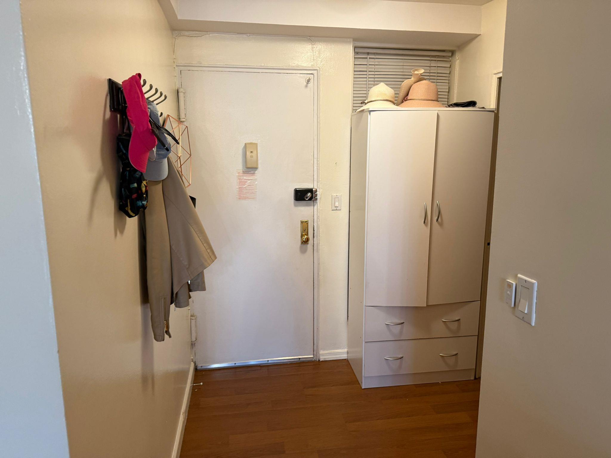 97-37 63rd Road, Unit 5N Queens, NY 11374 - Photo 2 of 17 Hall featuring wood finished floors and baseboards