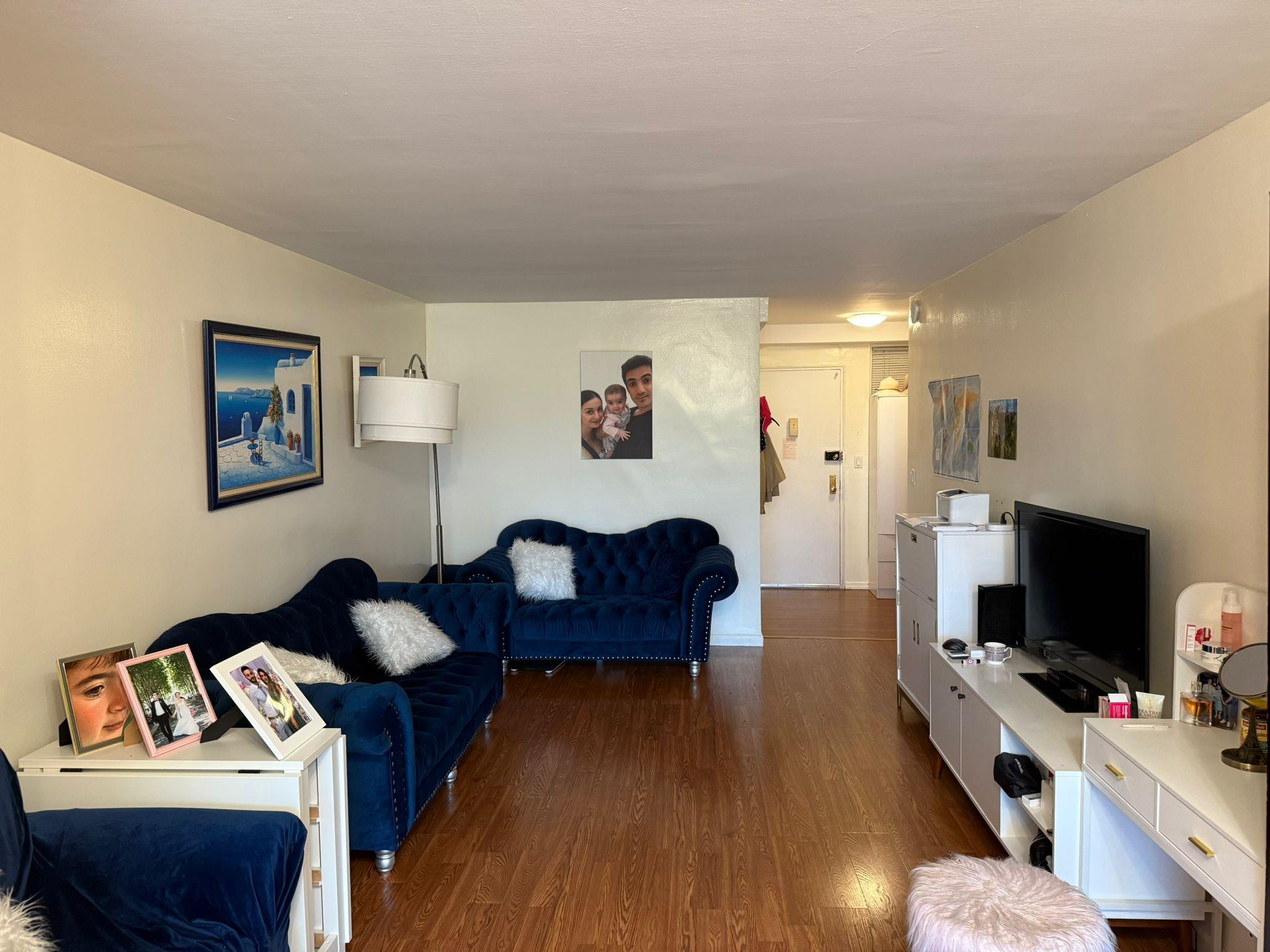 97-37 63rd Road, Unit 5N Queens, NY 11374 - Photo 3 of 17 Living area with dark wood finished floors