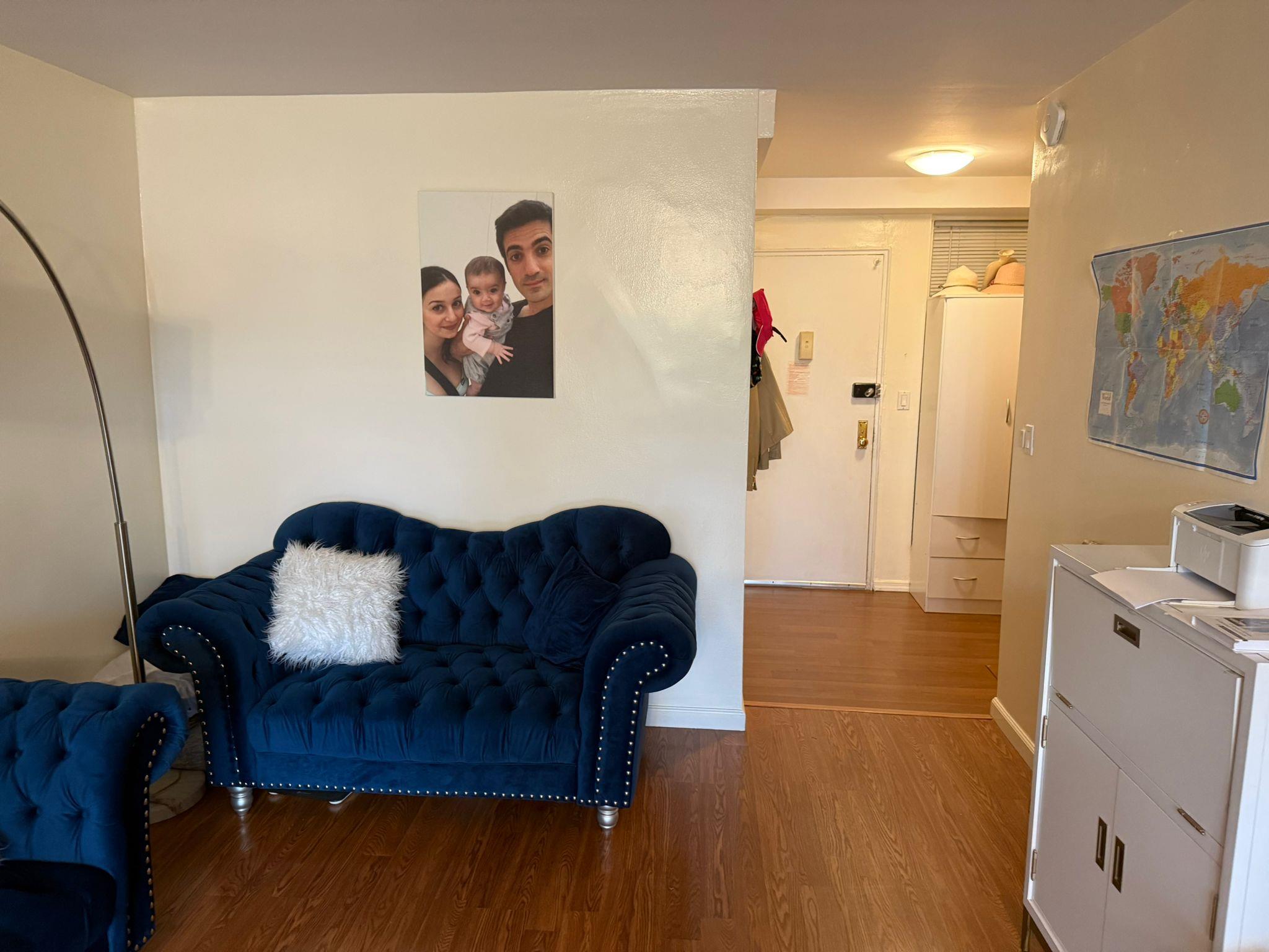 97-37 63rd Road, Unit 5N Queens, NY 11374 - Photo 4 of 17 Sitting room with wood finished floors and baseboards