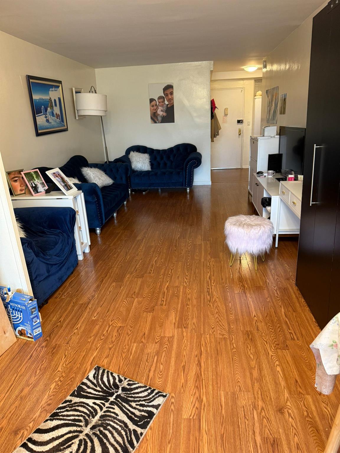 97-37 63rd Road, Unit 5N Queens, NY 11374 - Photo 6 of 17 Living area with wood finished floors