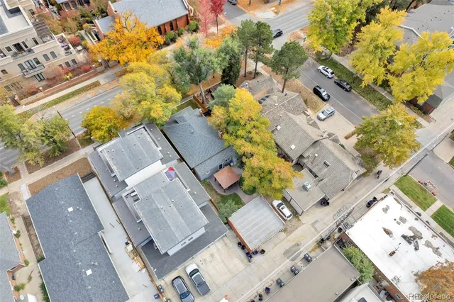 an aerial view of residential houses with outdoor space
