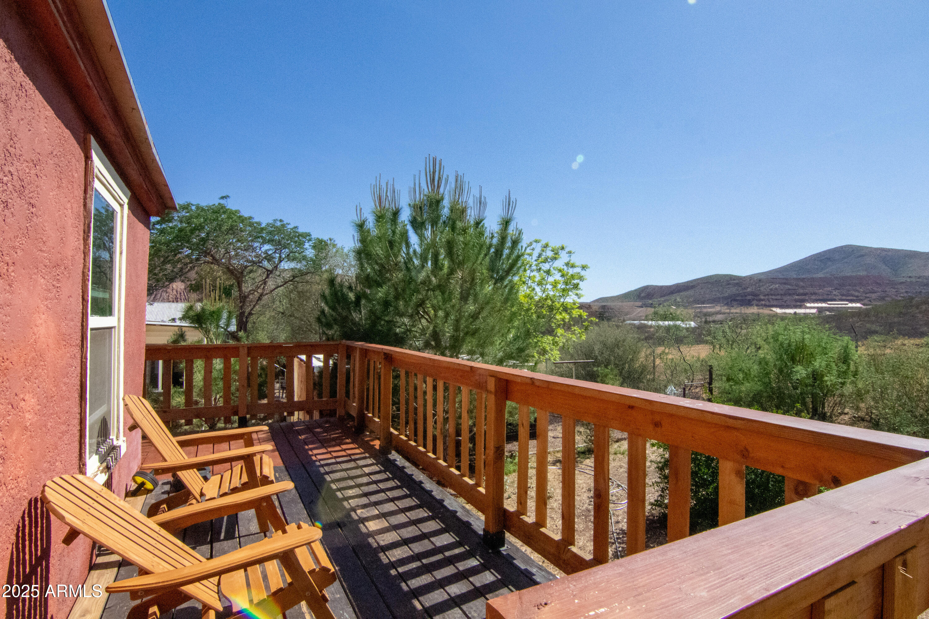 209 A Street Bisbee, AZ 85603 - Photo 15 of 23 a view of a two chairs on the roof deck