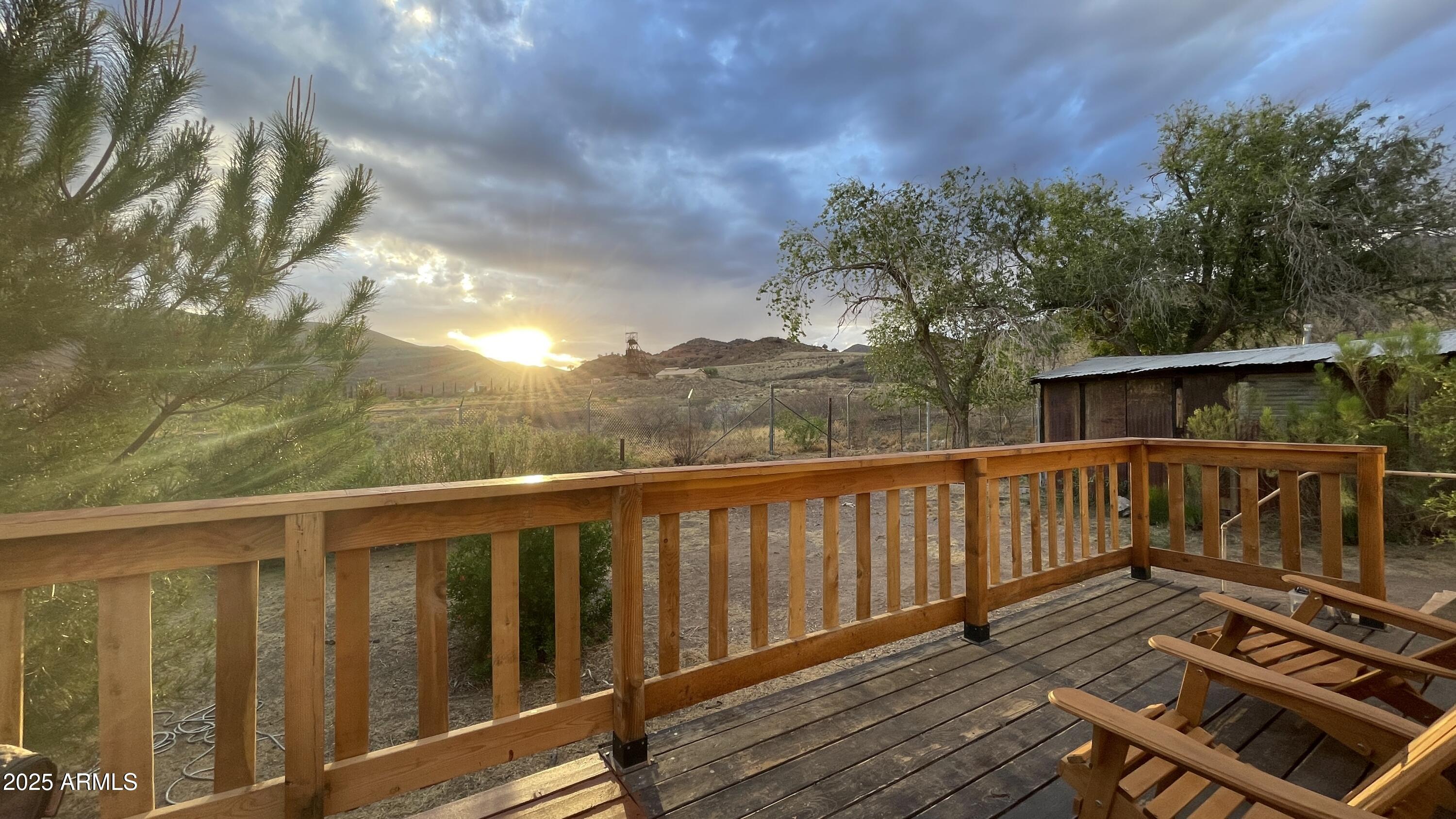 209 A Street Bisbee, AZ 85603 - Photo 16 of 23 a view of a balcony with wooden floor and fence