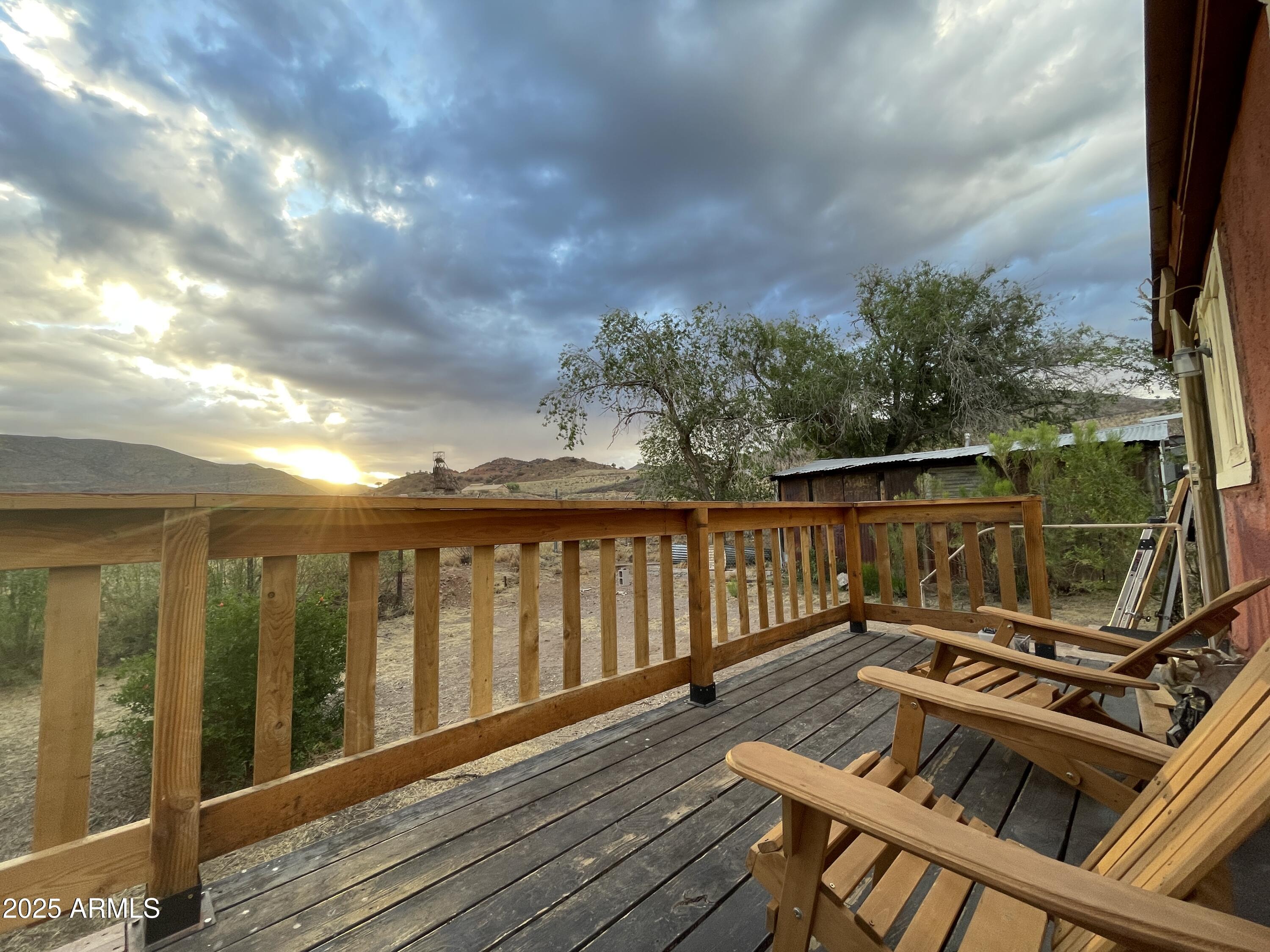 209 A Street Bisbee, AZ 85603 - Photo 18 of 23 a view of a balcony with wooden floor and fence