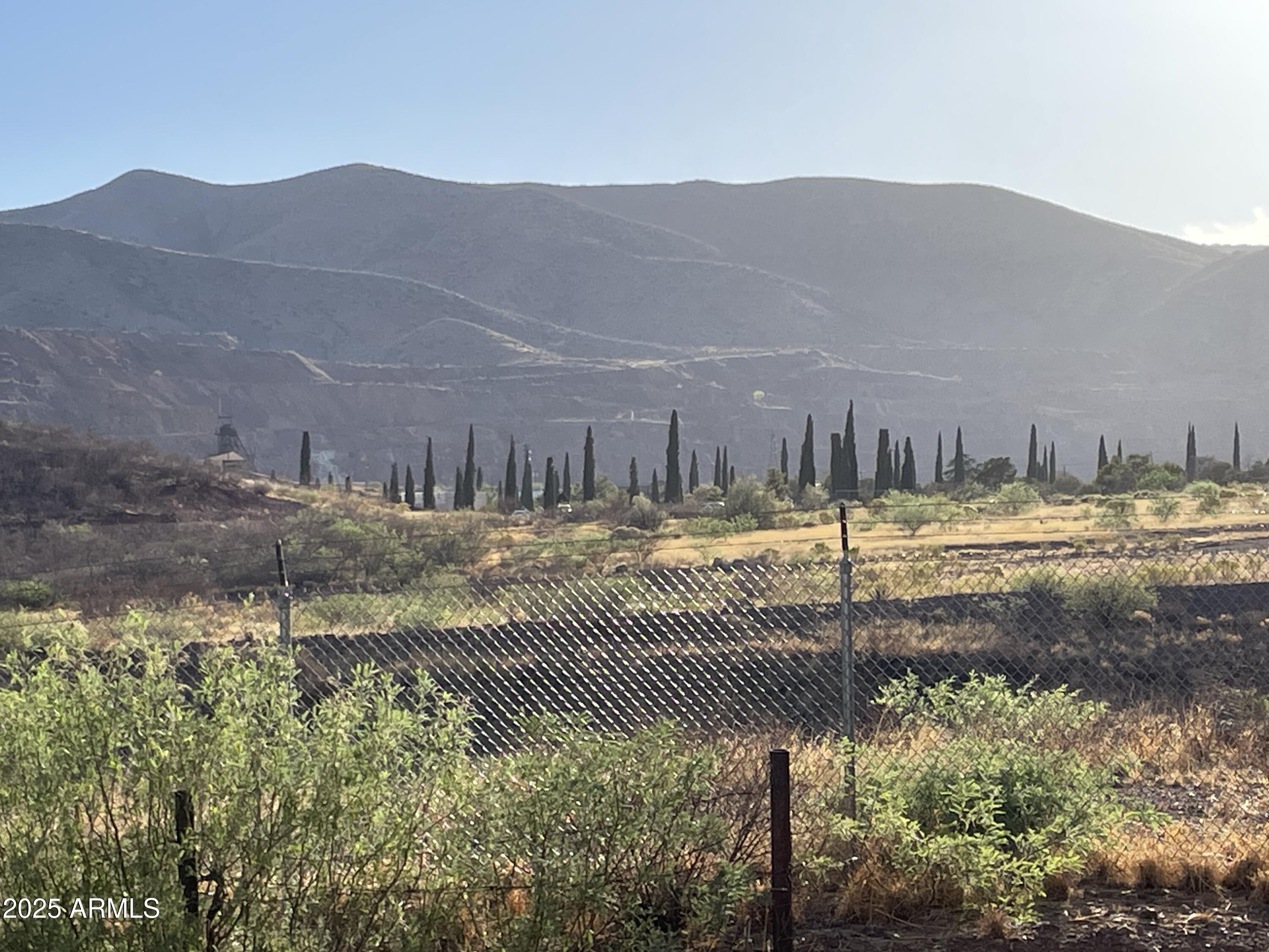 209 A Street Bisbee, AZ 85603 - Photo 22 of 23 a view of a swimming pool with a yard and mountain view