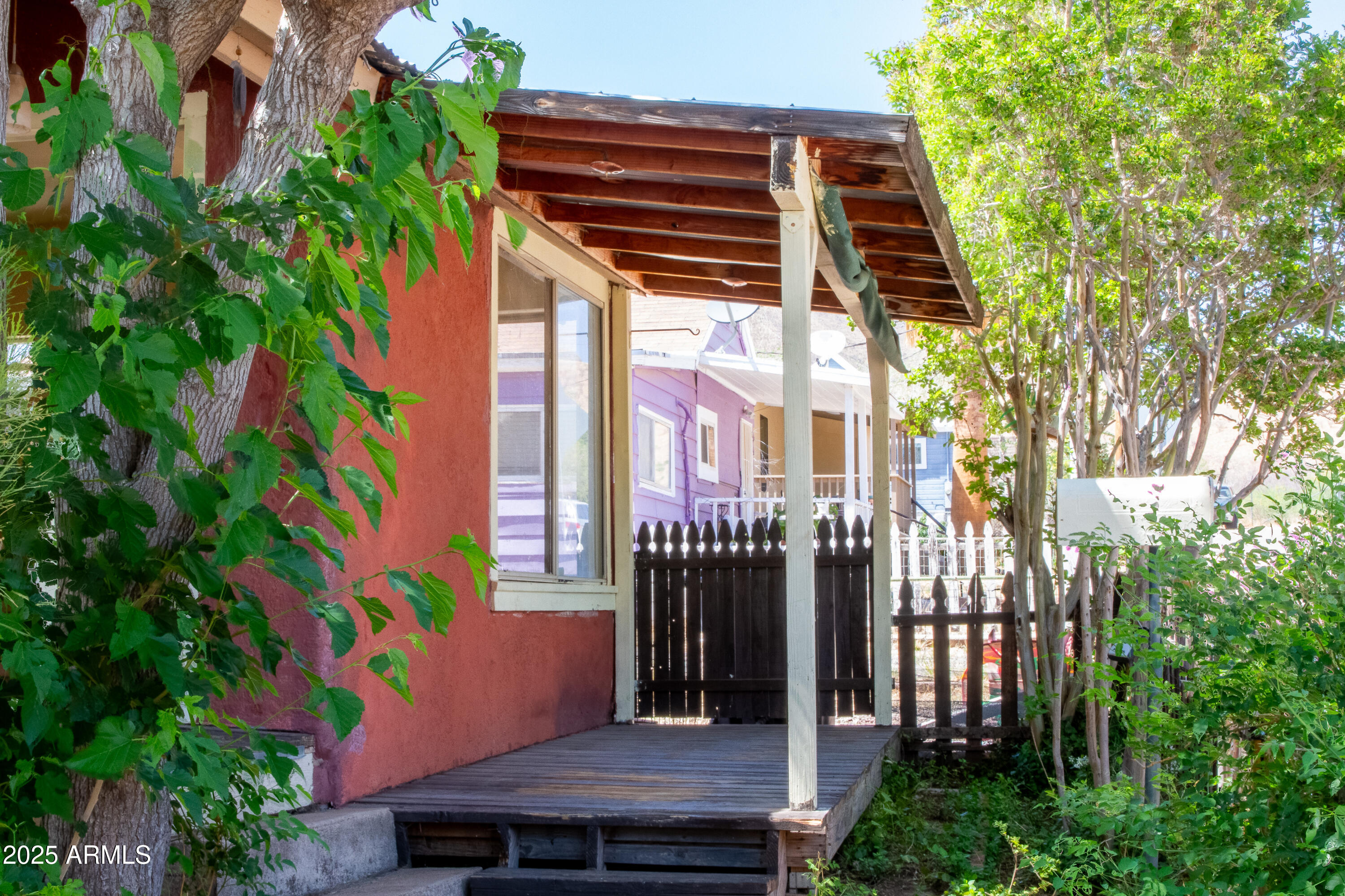 209 A Street Bisbee, AZ 85603 - Photo 2 of 23 a view of a chairs and table in a patio
