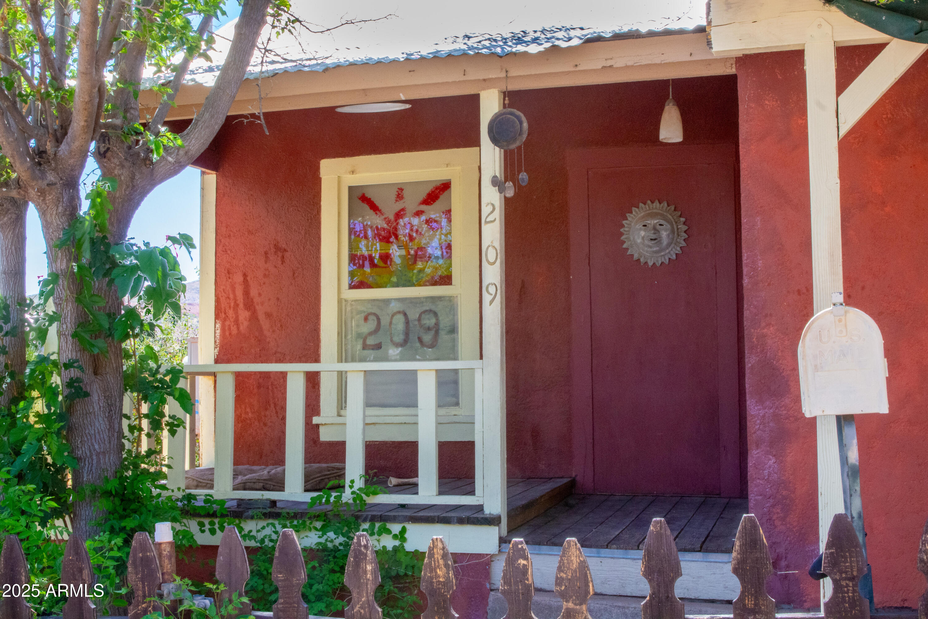 209 A Street Bisbee, AZ 85603 - Photo 3 of 23 a front view of a house with a glass door and shower