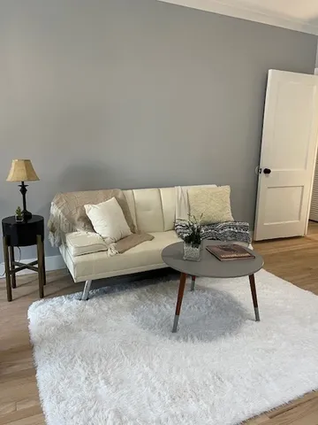 a living room with a couch and a coffee table