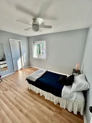 a bedroom with a bed and a dresser