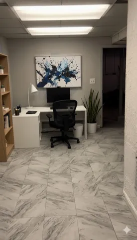 a living room with furniture and a potted plant