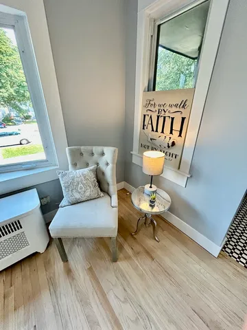 a living room with furniture and a window