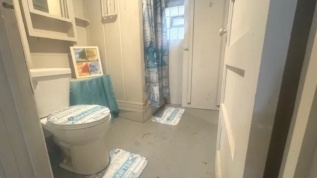 a bathroom with a toilet and a sink