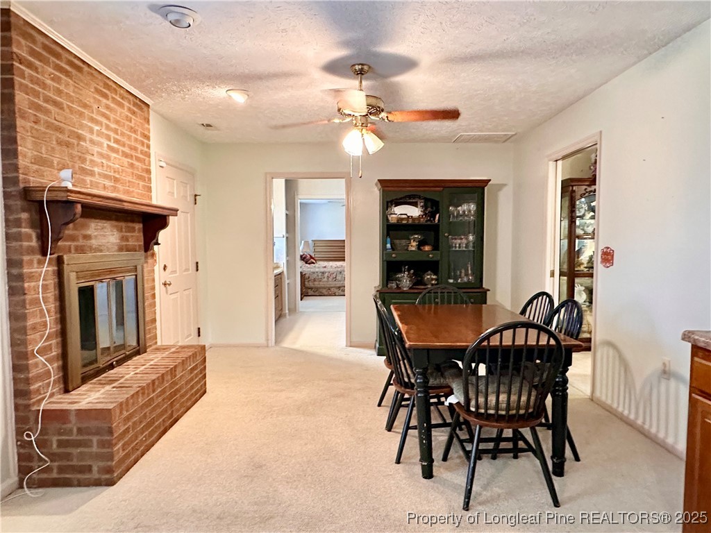 815 Whispering Pines Road Fayetteville, NC 28311 - Photo 13 of 38 a view of a dining room with furniture and chandelier