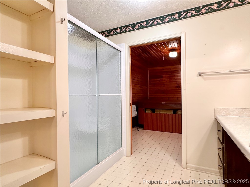 815 Whispering Pines Road Fayetteville, NC 28311 - Photo 26 of 38 a view of walk in closet and bedroom
