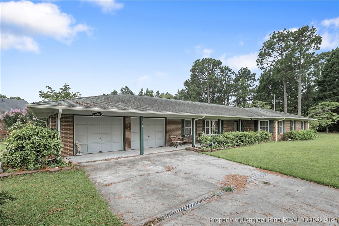 815 Whispering Pines Road Fayetteville, NC 28311 - Photo 3 of 38 front view of a house with a yard