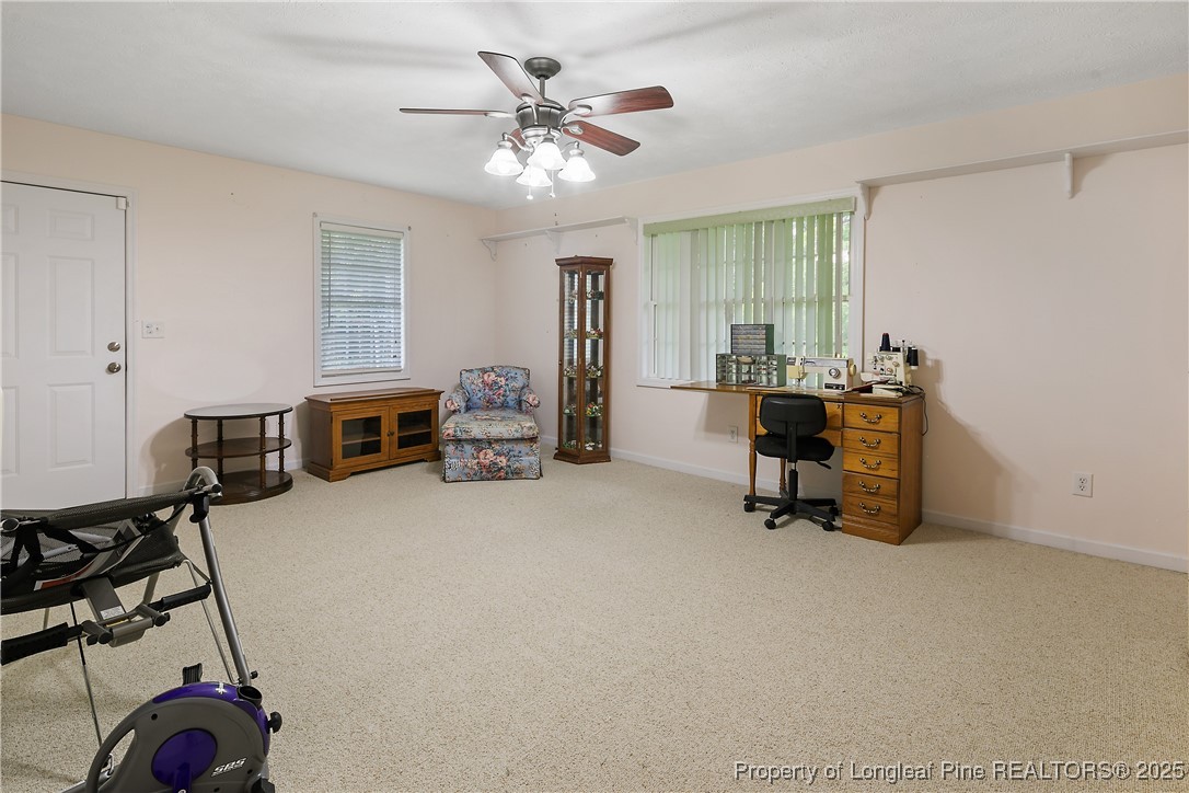 815 Whispering Pines Road Fayetteville, NC 28311 - Photo 31 of 38 a view of a livingroom with furniture and a ceiling fan