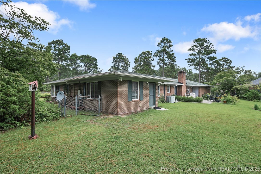 815 Whispering Pines Road Fayetteville, NC 28311 - Photo 36 of 38 a house that is sitting in the grass