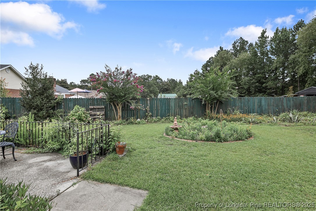 815 Whispering Pines Road Fayetteville, NC 28311 - Photo 37 of 38 a view of a garden with a fountain