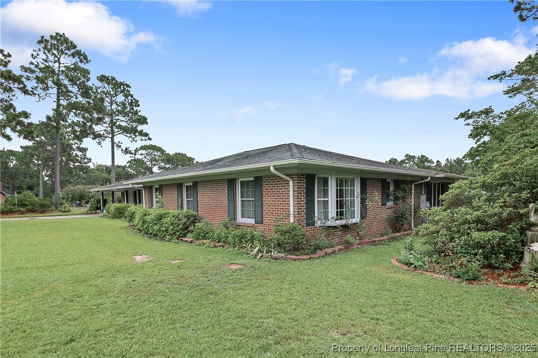 815 Whispering Pines Road Fayetteville, NC 28311 - Photo 5 of 38 a front view of house with yard and green space