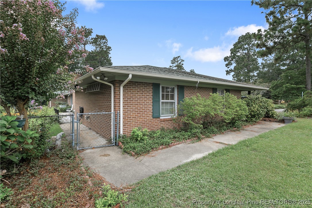 815 Whispering Pines Road Fayetteville, NC 28311 - Photo 6 of 38 a view of a back yard of the house