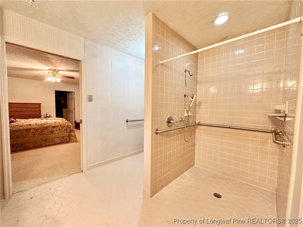 815 Whispering Pines Road Fayetteville, NC 28311 - Photo 7 of 38 a bathroom with a shower and a sink