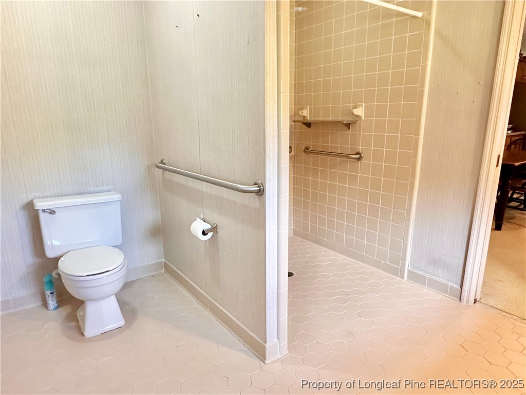 815 Whispering Pines Road Fayetteville, NC 28311 - Photo 8 of 38 a bathroom with a toilet and a shower