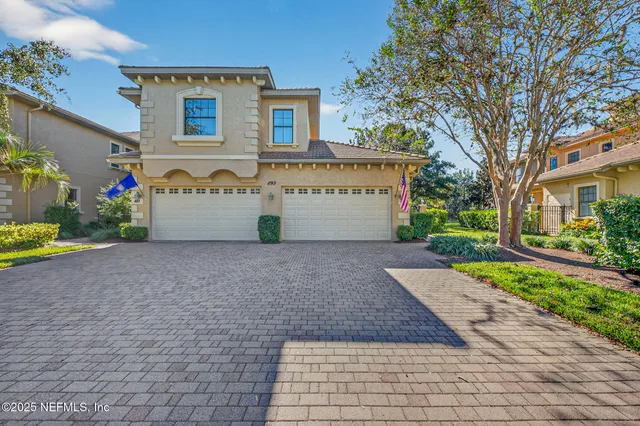 a view of a patio with table and chairs potted plants