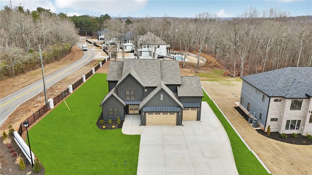 24 Rocking Wood Drive Auburn, GA 30011 - Photo 12 of 101 a view of a house with roof deck