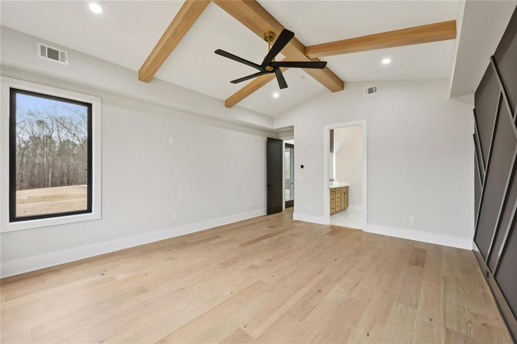 24 Rocking Wood Drive Auburn, GA 30011 - Photo 43 of 101 a view of empty room with wooden floor and fan