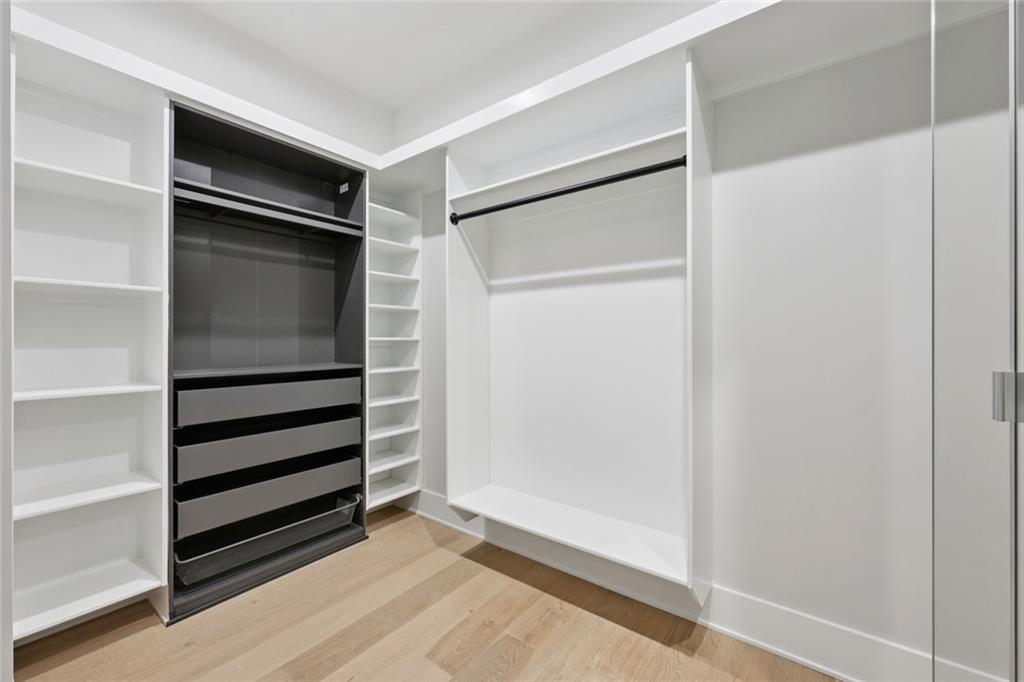 24 Rocking Wood Drive Auburn, GA 30011 - Photo 48 of 101 a view of walk in closet with empty racks