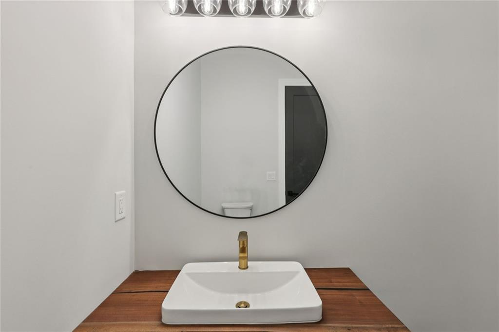 24 Rocking Wood Drive Auburn, GA 30011 - Photo 52 of 101 a bathroom with a sink and a mirror