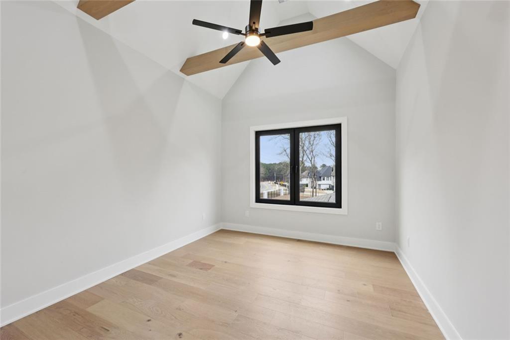 24 Rocking Wood Drive Auburn, GA 30011 - Photo 59 of 101 an empty room with a window and a ceiling fan