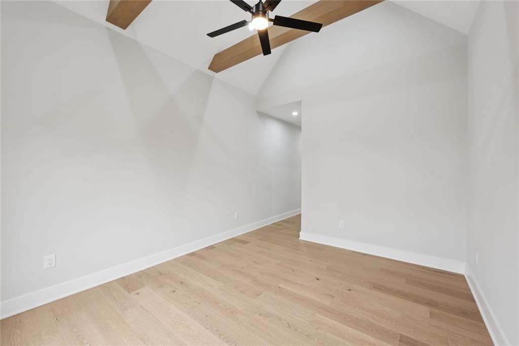 24 Rocking Wood Drive Auburn, GA 30011 - Photo 60 of 101 an empty room with wooden floor and fan