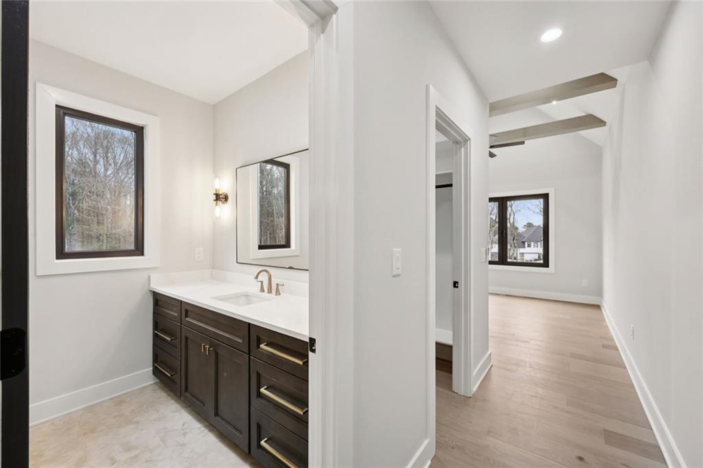 24 Rocking Wood Drive Auburn, GA 30011 - Photo 61 of 101 a spacious bathroom with a mirror sink and vanity