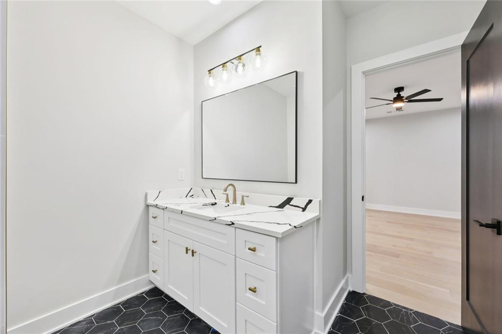 24 Rocking Wood Drive Auburn, GA 30011 - Photo 66 of 101 a spacious bathroom with a double vanity sink and mirror