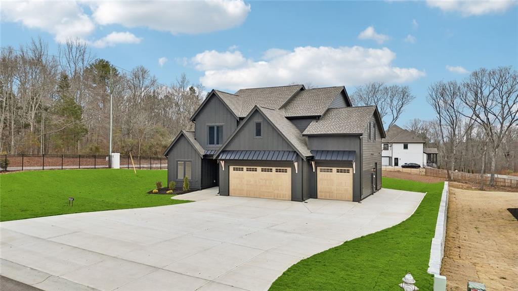 24 Rocking Wood Drive Auburn, GA 30011 - Photo 7 of 101 a front view of a house with a yard and trees