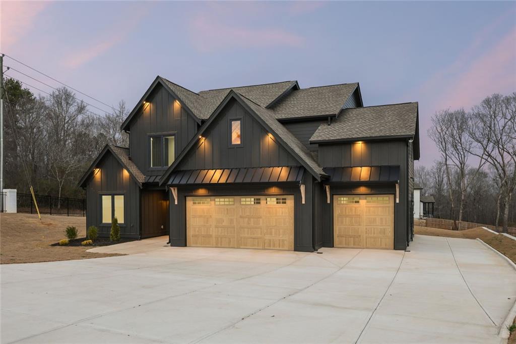 24 Rocking Wood Drive Auburn, GA 30011 - Photo 74 of 101 a front view of a house with a yard and garage
